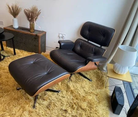 Eames Lounge Chair, used in a living room, office, or study, adds a unique touch to any space with its sleek design.